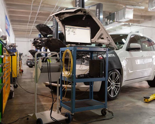White BMW X5 Undergoing Diagnostic Testing